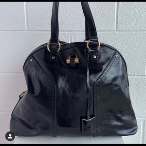 YSL.    black patent leather bowler bag with double zip closure.